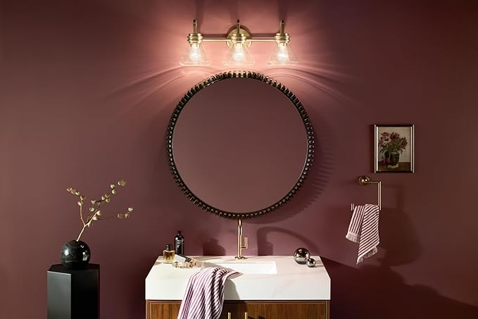 Kichler Farum 26" 3-Light Vanity Light with Clear Glass in Champagne Bronze, for Single or Double Vanity, Over a Mirror, Powder Room, Bathroom, (26" W x 9.5" H) 55155CPZCLR