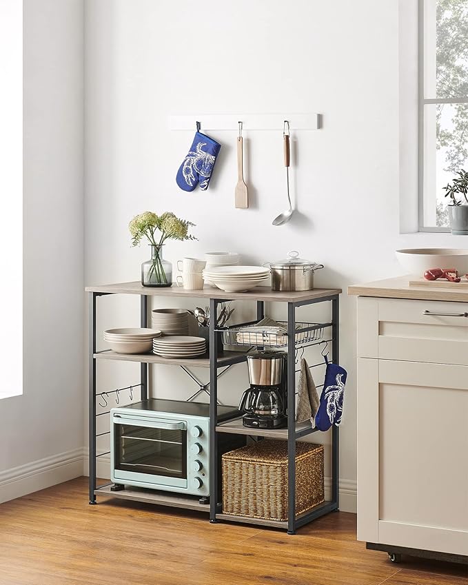 VASAGLE ALINRU Kitchen Baker’s Rack, Coffee Bar, Microwave Oven Stand, with Steel Frame, Wire Basket, 6 Hooks, for Mini Oven, Spices Utensils, Industrial, Heather Greige and Ink Black UKKS090B02